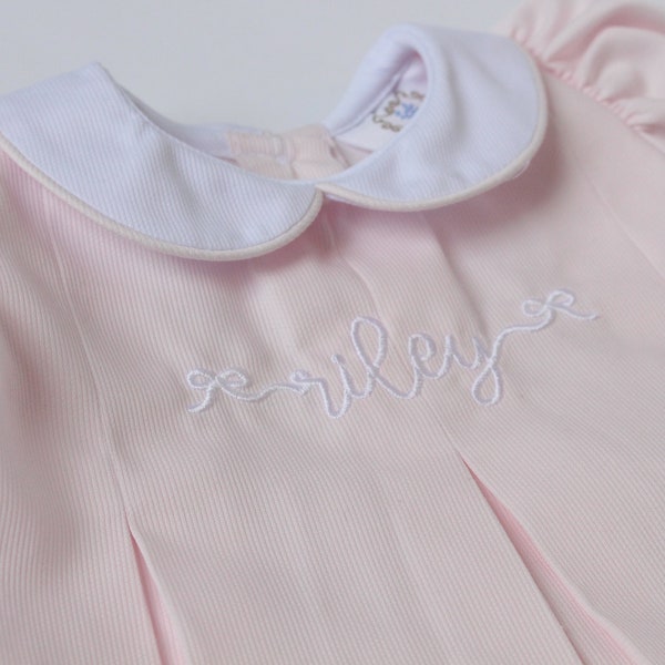 Pink monogrammed pleated dress