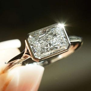 Radiant Cut Colorless Moissanite Wedding Ring, East West Engagement Ring, Bezel Set Anniversary Ring, Radiant Cut Solitaire Ring For Women