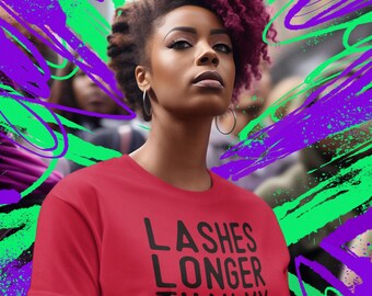 May include: A woman with pink hair is wearing a red t-shirt with the text "Lashes Longer Than My Patience" printed in black.