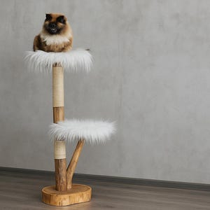 May include: A multi-level cat tree with a brown and white cat perched on the top level. The cat tree has two platforms covered in white faux fur. The structure is made of wood and rope, with a round base.