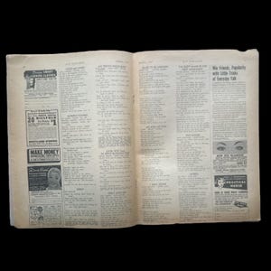 May include: A vintage magazine spread featuring several advertisements and song lyrics. The ads include a billfold, a make money opportunity, a beauty product, and a practical nurse course. The song lyrics include titles like "My Pretty Shoo-gah", "Read to Be Unhappy", "My Son, My Son", "I Tried Again", and "Only Love Me".