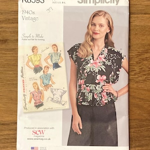 May include: A Simplicity sewing pattern envelope K8593 for a 1940s vintage style blouse. The white paper envelope features the text Simplicity, K8593, and 1940s Vintage, with an illustration of five blouse variations and a photo of a floral top.