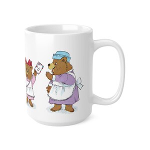 May include: White ceramic mug with a colorful illustration of three bears wearing dresses and aprons. The bears are holding letters and packages.