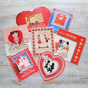 7 vintage valentijnskaarten voor kinderen: ramen met rode en blauwe hartjes
