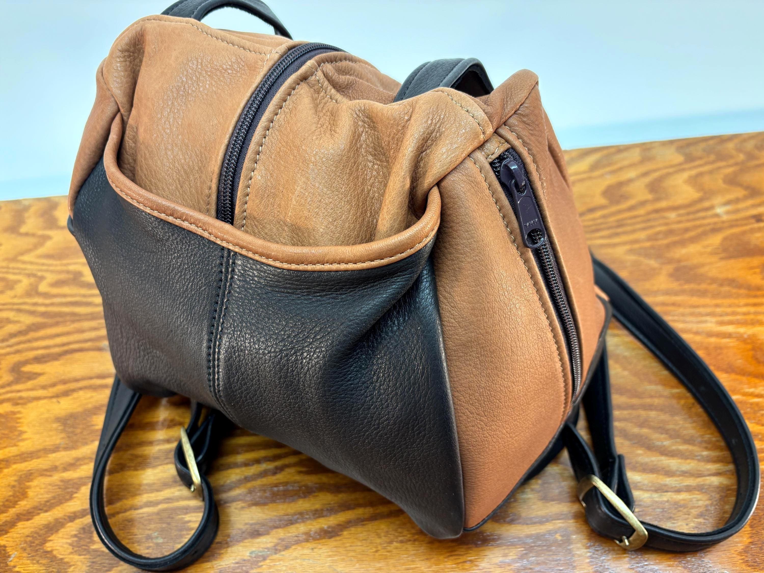 deerskin leather backpack DAILY LUXURY Gabbana logo strap Fabric lining and zipped pocket Item comes with a branded dust bag Measurements Deerskin Leather Backpack: Full-Size, Secure