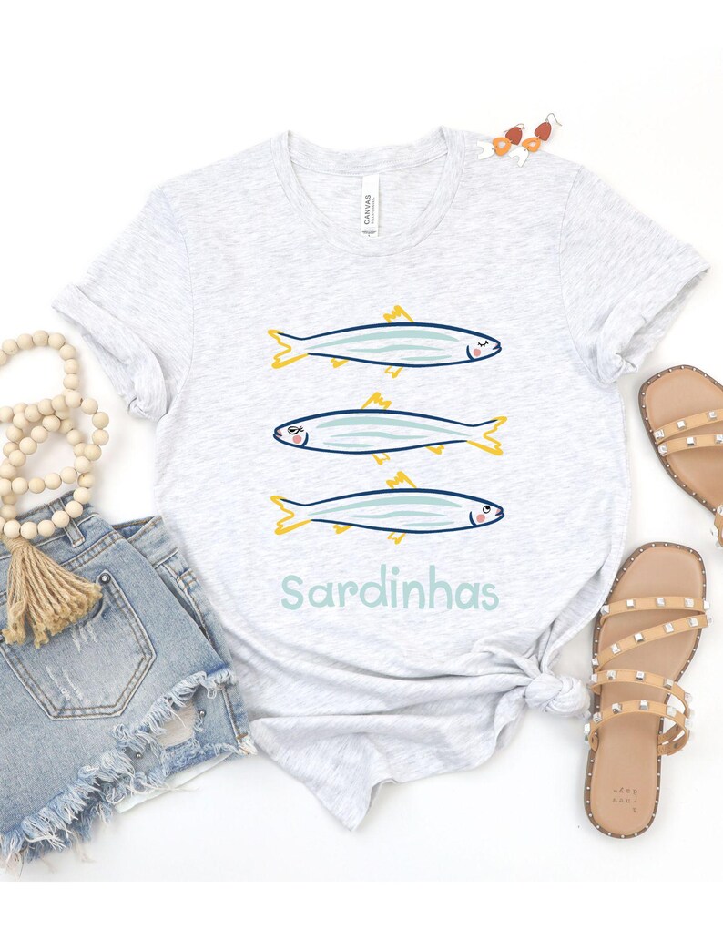 Cute sardines t-shirt is perfect for seafood lovers, beachgoers, and anyone who enjoys a touch of Portuguese sardine art in their wardrobe