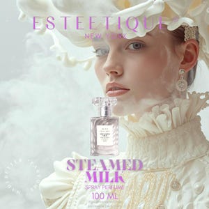 May include: A perfume bottle with a clear, faceted stopper and a rectangular body. The label reads "STEAMED MILK" and "SPRAY PERFUME 100 ML." The background features a woman in a white ruffled collar and a floral headpiece, with the text "ESTEETIQUE NEW YORK."