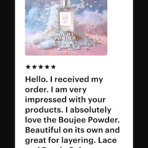 May include: A perfume bottle with the text "BOUJEE POWDER PERFUME" and the brand name "ESTETIQUE NEW YORK" is displayed on a pink and blue background. The image includes a customer review with a five-star rating.