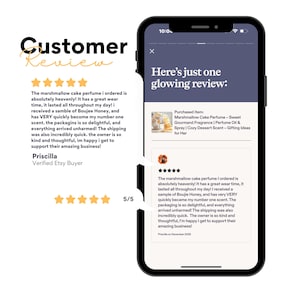 May include: A smartphone screen displays a customer review for a perfume product. The review text praises the scent and longevity of the perfume. The screen also shows the product name and a 5/5 rating.