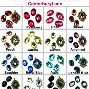 May include: A selection of oval mirror glass gems in colours such as ruby, sapphire, and emerald. Each gem measures approximately 18x13mm, some with decorative metal settings. The text "18x13 Oval Mirror Glass CanterburyLane" is displayed at the top.