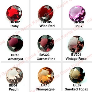 May include: Nine round, faceted gemstones in various shades of red, pink, and brown. The gemstones are labeled with their names and codes, such as "Ruby", "Wine Red", "Amethyst", "Garnet Pink", "Vintage Rose", "Peach", "Champagne", and "Smoked Topaz".