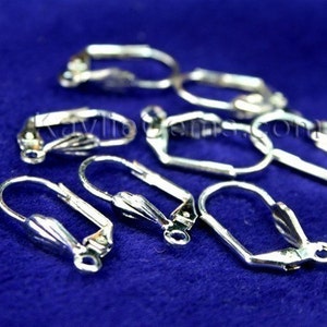 May include: Silver-toned earring findings, also known as earring hooks, are a set of 10 pieces. The hooks are made of metal and have a smooth, polished finish. They are designed to be used with a variety of earring styles.
