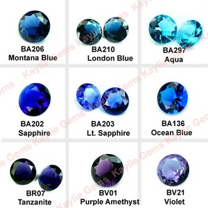 May include: An assortment of round, faceted gemstones in various shades of blue and purple. The gemstones are labelled with their names and codes, including Montana Blue (BA206), London Blue (BA210), Sapphire (BA202), Lt. Sapphire (BA203), Ocean Blue (BA136), Aqua (BA297), Tanzanite (BR07), Purple Amethyst (BV01), and Violet (BV21).