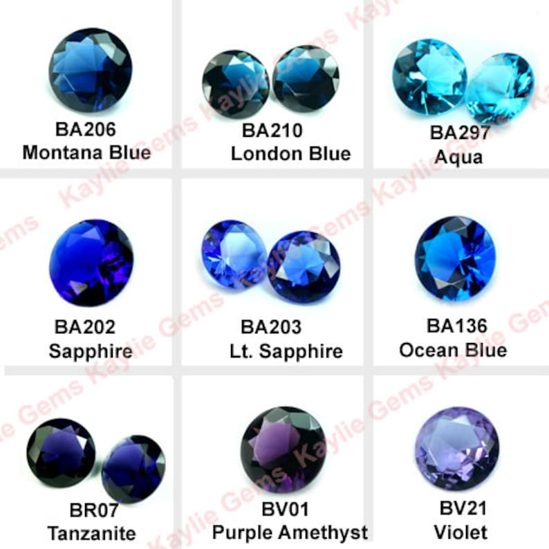 May include: An assortment of round, faceted gemstones in various shades of blue and purple. The gemstones are labelled with their names and codes, including Montana Blue (BA206), London Blue (BA210), Sapphire (BA202), Lt. Sapphire (BA203), Ocean Blue (BA136), Aqua (BA297), Tanzanite (BR07), Purple Amethyst (BV01), and Violet (BV21).