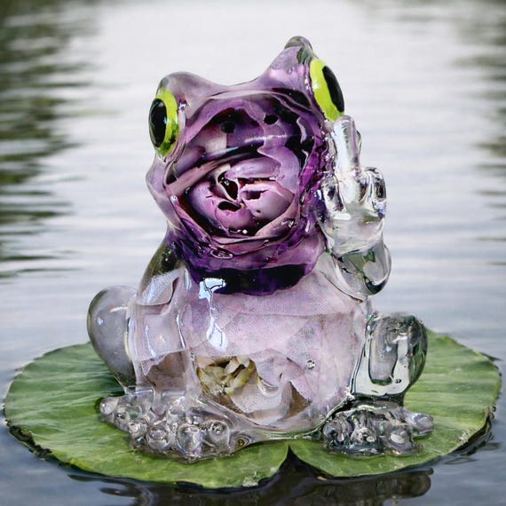 Hand-cast resin grumpy frog ornament with tiny flowers — tiny, weird, and genuinely one-of-a-kind desk creature.