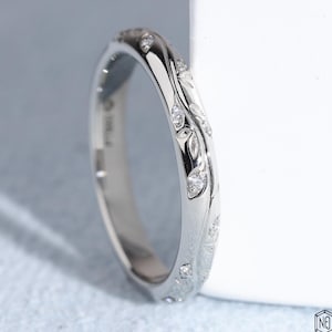 May include: A set of three ceramic mugs with a speckled, matte finish. The mugs are in shades of cream, light gray, and dark gray. Each mug has a simple, minimalist design, perfect for coffee or tea.