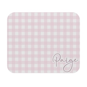 May include: A square, rounded-corner coaster with a pink and white gingham pattern. The name "Paige" is written in a cursive font in the lower right corner. The coaster is a light pink color.