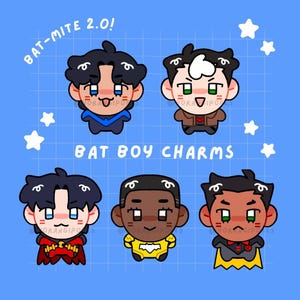 May include: A digital illustration featuring five chibi-style characters on a blue grid background. Text reads BAT-MITE 2.0! and BAT BOY CHARMS. The characters have dark hair, expressive eyes, and colourful outfits including capes and emblems.
