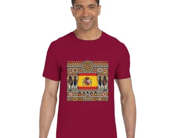 May include: A maroon t-shirt featuring a detailed graphic of the Spanish flag and ornate architectural elements. The design includes the Spanish coat of arms and decorative patterns in various colors.
