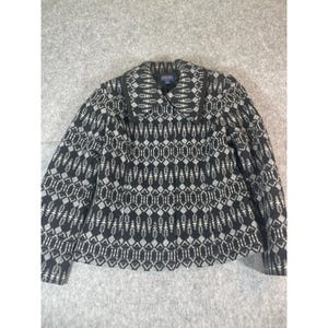 May include: A black and grey long-sleeve jacket featuring a repeating geometric pattern of diamonds and vertical arrow-like shapes. The jacket has a wide collar, a button-front closure, and a Pendleton brand label visible on the inner neck area.