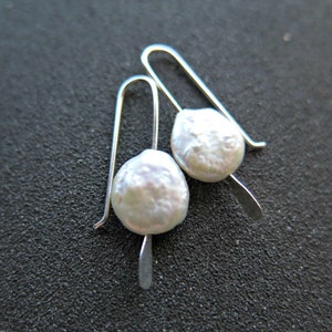 small white coin pearl earrings. white pearl jewelry. modern pearl jewellery.