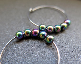 colorful rainbow hematite earrings. one inch niobium hoops in 20 gauge wire. hypoallergenic jewelry.