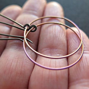 rose gold earrings in anodized titanium. niobium jewelry. hypoallergenic ear wires. modern hoops made in Calgary.