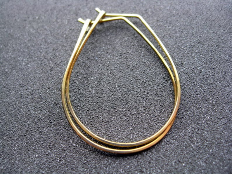 yellow gold earrings in niobium wire. hoop earrings. hypoallergenic jewelry, splurge. image 1