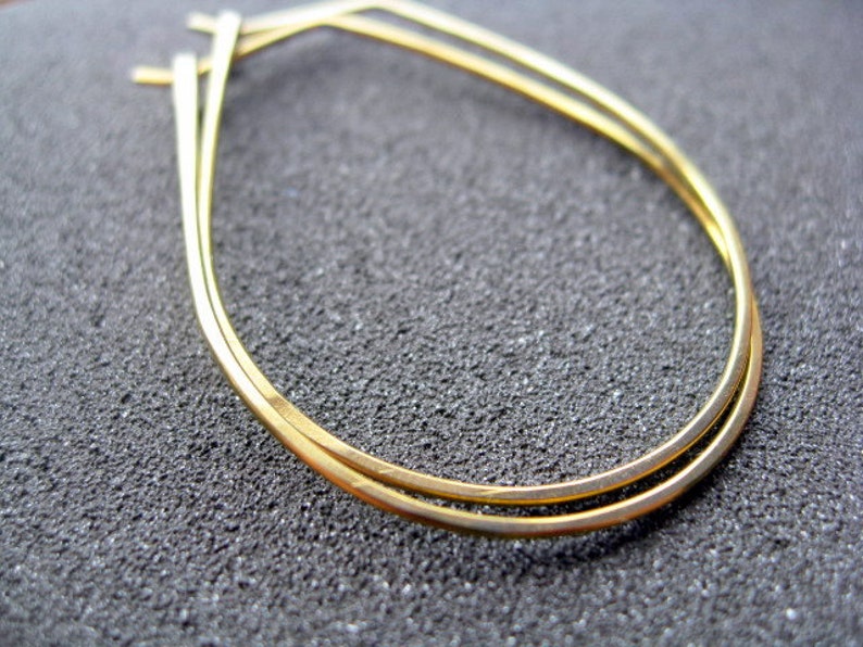 yellow gold earrings in niobium wire. hoop earrings. hypoallergenic jewelry, splurge. image 4