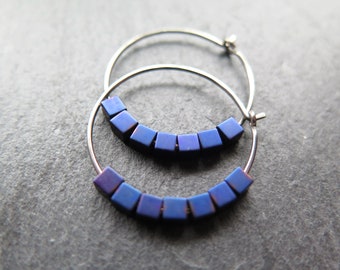 indigo earrings with hematite cubes. hypoallergenic niobium hoops for sensitive ears. modern purple blue jewelry.