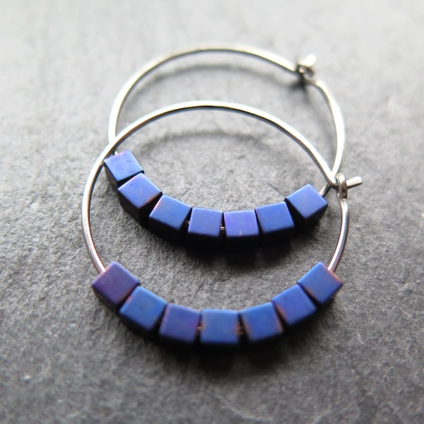 indigo earrings with hematite cubes. hypoallergenic niobium hoops for sensitive ears. modern purple blue jewelry.