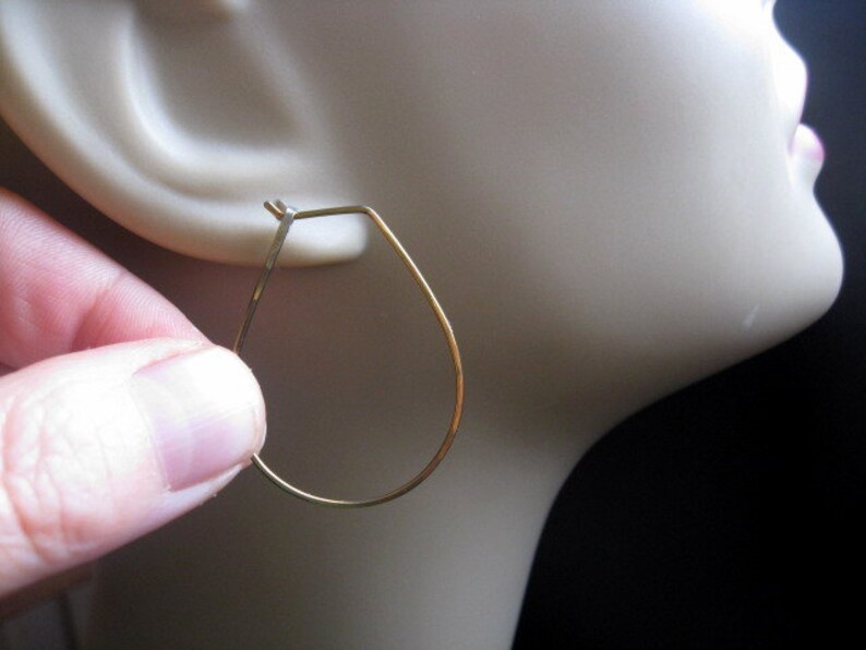 yellow gold earrings in niobium wire. hoop earrings. hypoallergenic jewelry, splurge. image 3