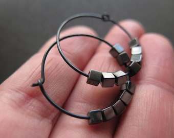 black earings. hematite earrings in anodized niobium. hammered hoops for sensitive ears.