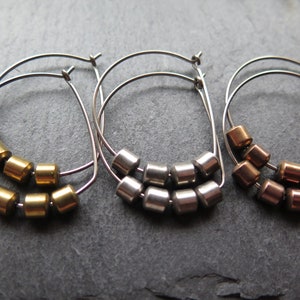 hypoallergenic hoop earrings. silver and gold jewelry. niobium earwires. sensitive ears. image 8