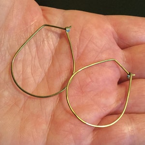 yellow gold earrings in niobium wire. hoop earrings. hypoallergenic jewelry, splurge. image 5