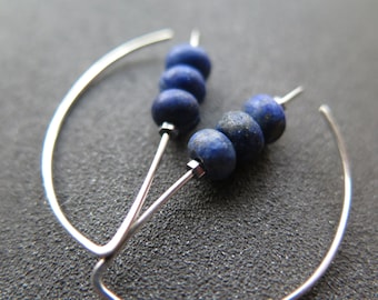 matte blue lapis earrings. cobalt blue earrings. genuine lapis lazuli jewelry. dark blue stones with a matte polish.