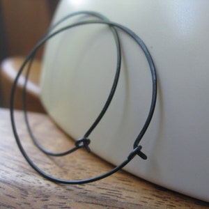 black hoop earrings. hammered niobium hoops. hypoallergenic jewelry. made in Calgary, Alberta.