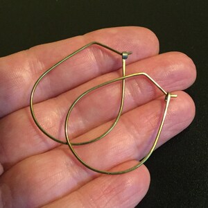 yellow gold earrings in niobium wire. hoop earrings. hypoallergenic jewelry, splurge. image 2