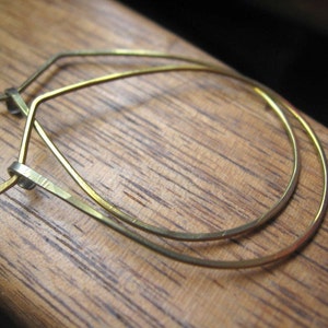 yellow gold earrings in niobium wire. hoop earrings. hypoallergenic jewelry, splurge. image 6