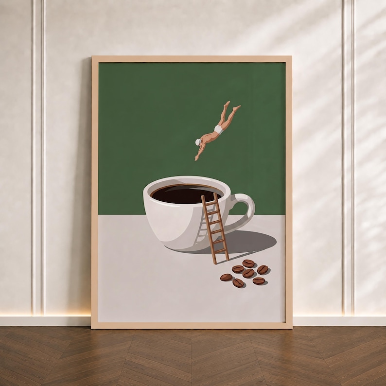 May include: A framed wall art print featuring a white coffee cup filled with dark liquid, a wooden ladder leaning against the side, a swimmer diving into the coffee, and several scattered brown coffee beans on a light grey surface against a green background.