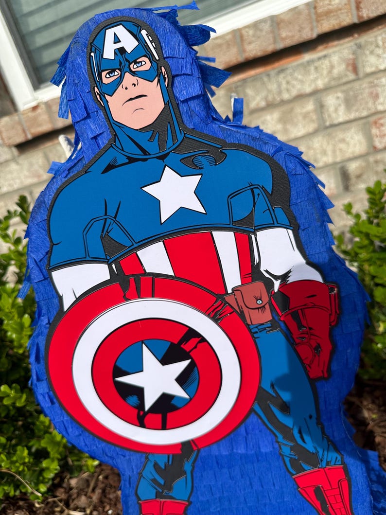 May include: A blue and red Captain America pi&ntilde;ata with a white star on his chest and a red, white and blue shield.