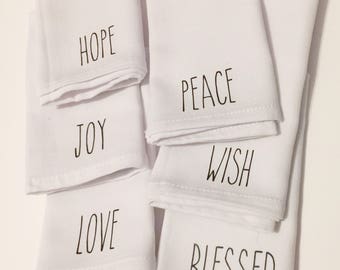 Pack of 6 thick quality napkins in white with black text.  Perfect for Christmas dinners, hostess gifts, or realtor gifts.