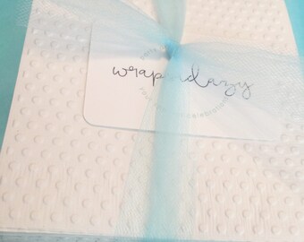 Set of 20 white polka dot embossed napkins for your bridal shower or party.  Beverage size  Square.