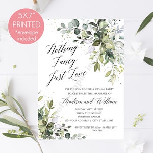 May include: A 5x7 inch printed wedding invitation with a watercolor design of green leaves and gold glitter. The text reads "Nothing Fancy Just Love" and includes the names "Madison and William", the date "Sunday, May 1st, 2022", the time "5:00 in the evening", the location "Sunshine Ranch", and the address "1234 Your Address City, State 12345".