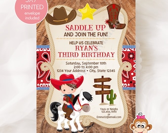 May include: A 5x7 inch printed invitation for a cowboy themed third birthday party. The invitation features a cartoon cowboy riding a horse with a red bandana and a cowboy hat. The text on the invitation reads "Saddle Up and Join the Fun!" and "Help us celebrate Ryan's Third Birthday".