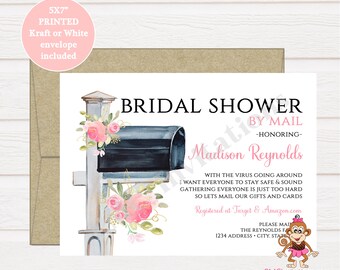 May include: A white card with a pink and blue watercolor illustration of a mailbox with flowers. The text "BRIDAL SHOWER BY MAIL -HONORING- Madison Reynolds" is printed on the card. The text "WITH THE VIRUS GOING AROUND WANT EVERYONE TO STAY SAFE & SOUND GATHERING EVERYONE IS JUST TOO HARD SO LETS MAIL OUR GIFTS AND CARDS Registered at Target & Amazon.com PLEASE MAIL THE REYNOLDS FAMILY 1234 ADDRESS - CITY, STATE" is also printed on the card.