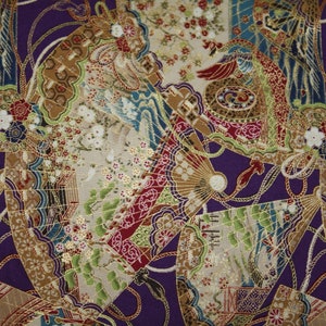 May include: A patterned fabric with a repeating design of fans, flowers, and birds in purple, gold, red, green, and blue. The fabric has a textured appearance with intricate details.