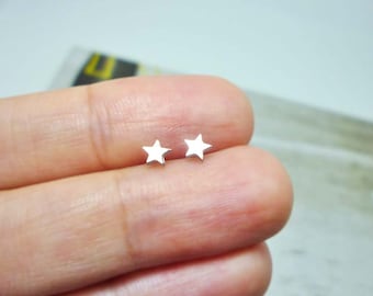Mini pendientes de estrella de acero inoxidable
