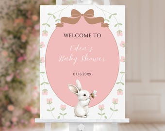 Könnte beinhalten: Ein rosa-weißes Willkommens-Schild für eine Babyparty mit einem Hasen und einer Biene. Das Schild lautet "Willkommen zu Edens Babyparty 03.16.20XX".