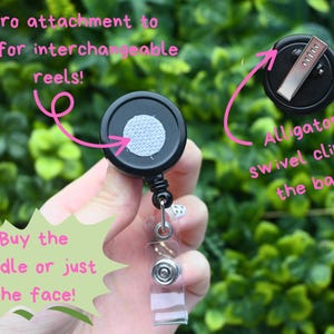 May include: Black retractable badge reel with a Velcro attachment for interchangeable reels. Features an alligator swivel clip on the back. The image includes text that says, "Buy the bundle or just the face!"